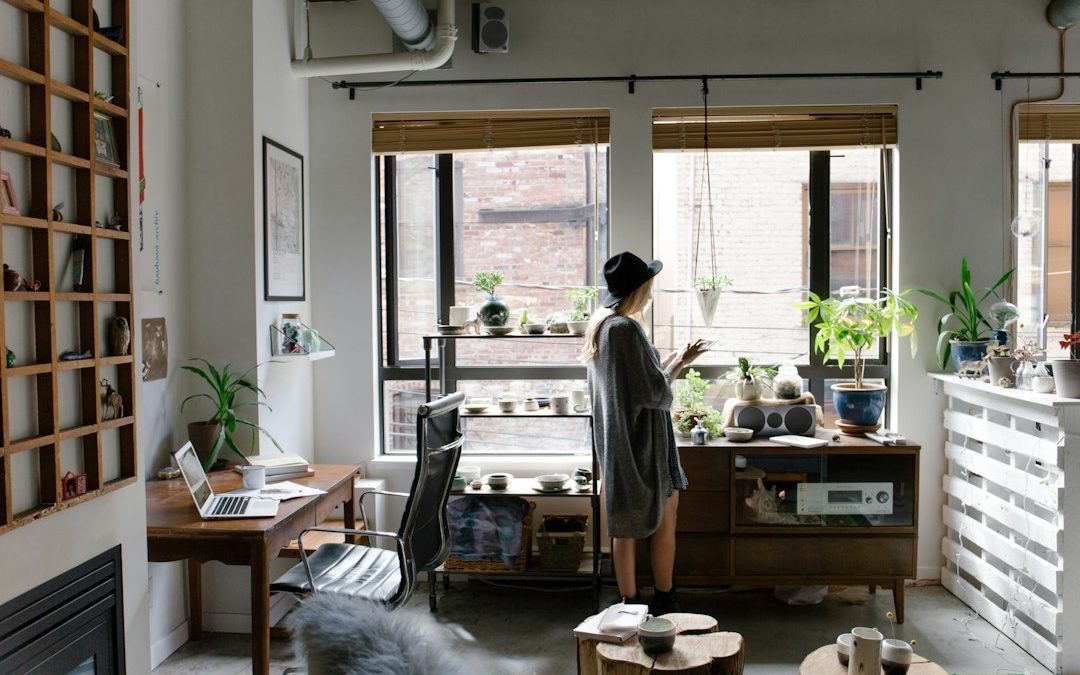 A women standing in living room with full of accessories