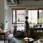 A women standing in living room with full of accessories