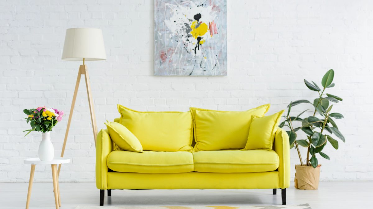 living room with yellow sofa
